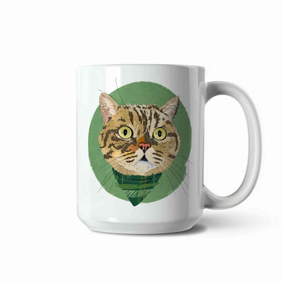 A white ceramic coffee mug featuring a custom illustrated cat portrait of a tabby cat wearing a plaid bandana set against a subtle textured green circular background printed on the side of the mug, shown on a clean white background. 
