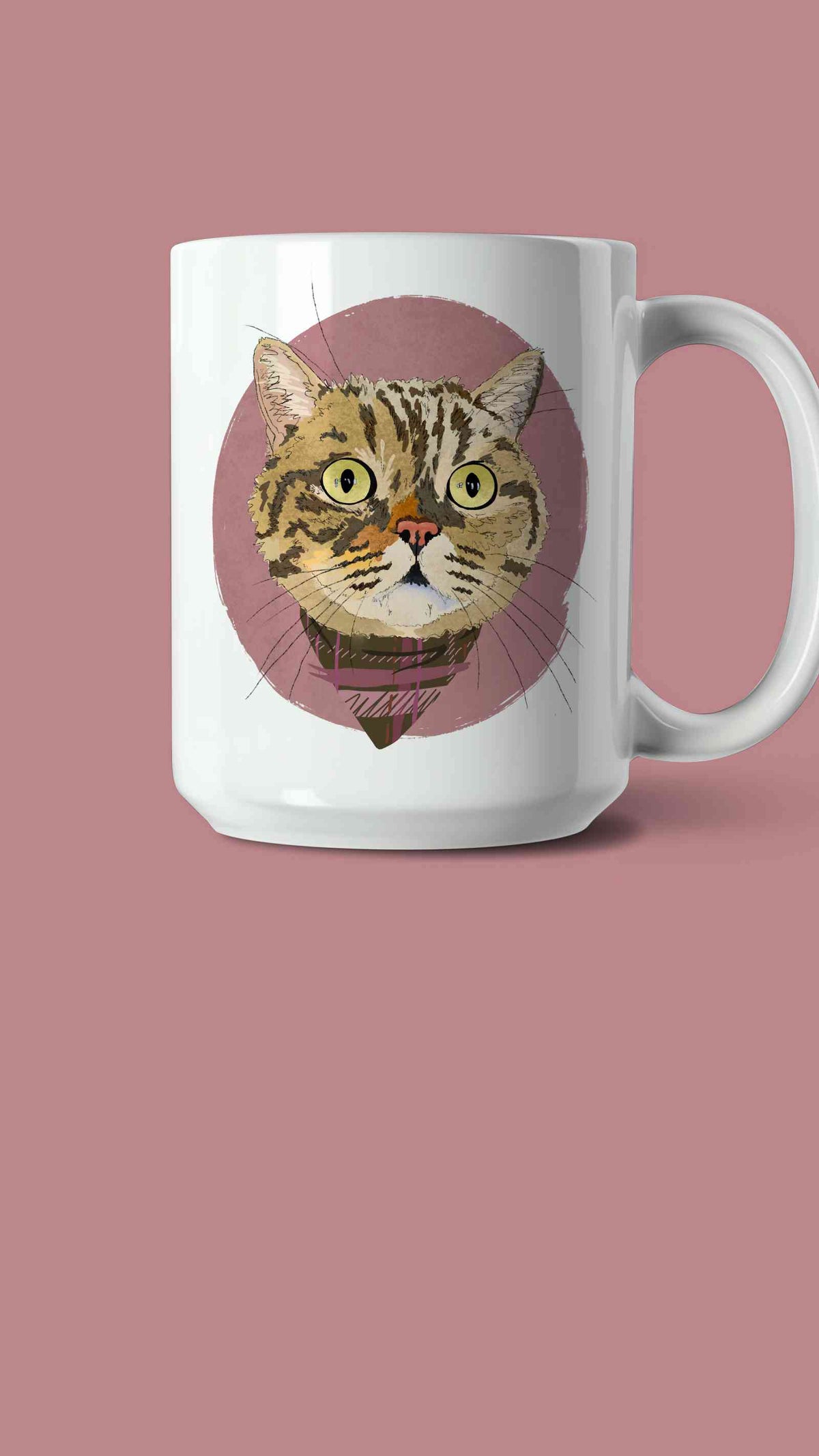 A white ceramic coffee mug featuring a custom illustrated cat portrait of a tabby cat wearing a plaid bandana set against a subtle textured dusty rose circular background printed on the side of the mug, shown on a dusty rose background. 